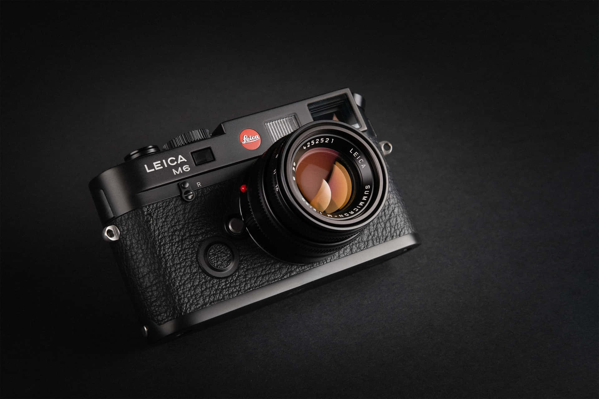 Professional Photography with Black Leica M6 Camera Wallpaper