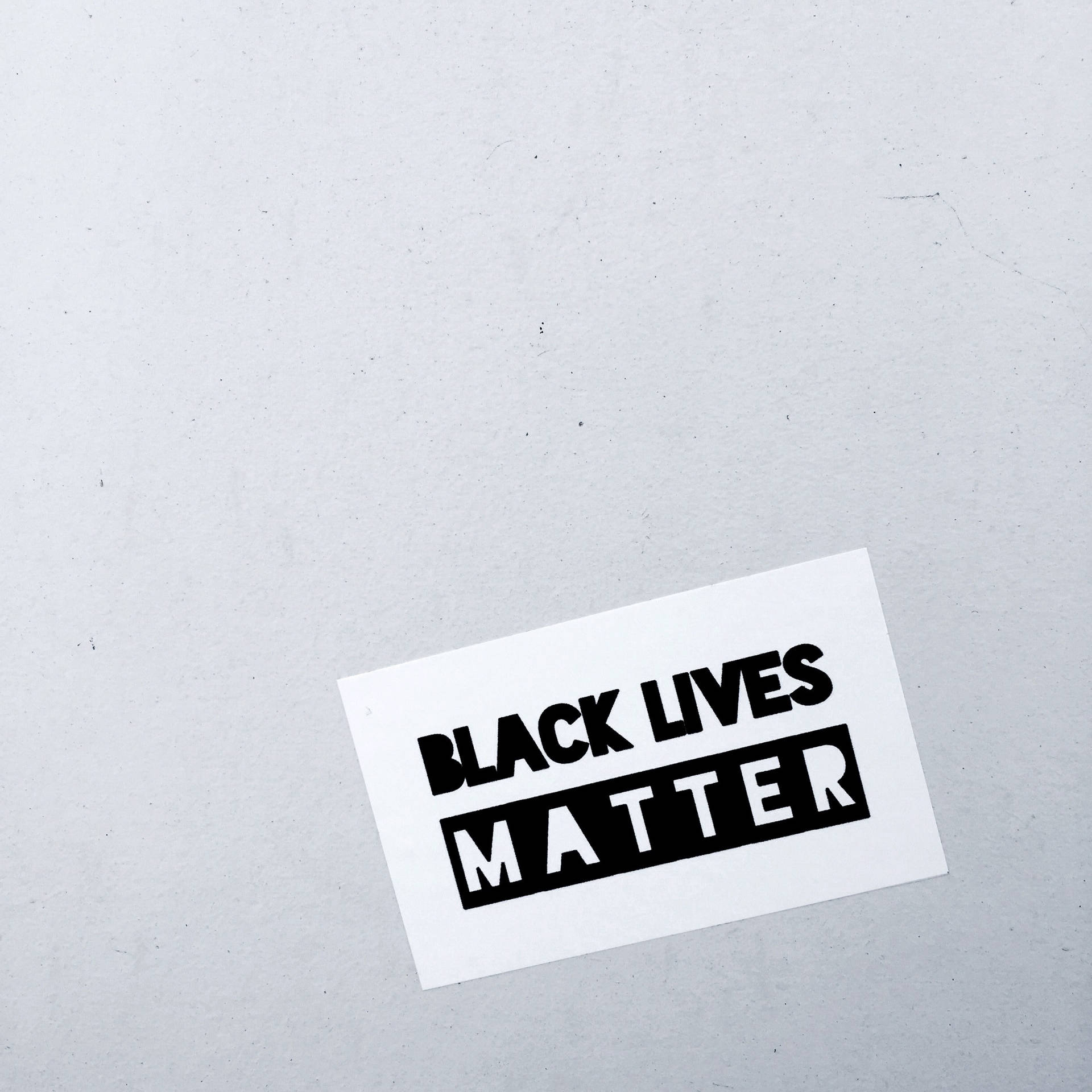 Black Lives Matter Sticker On Wall Background