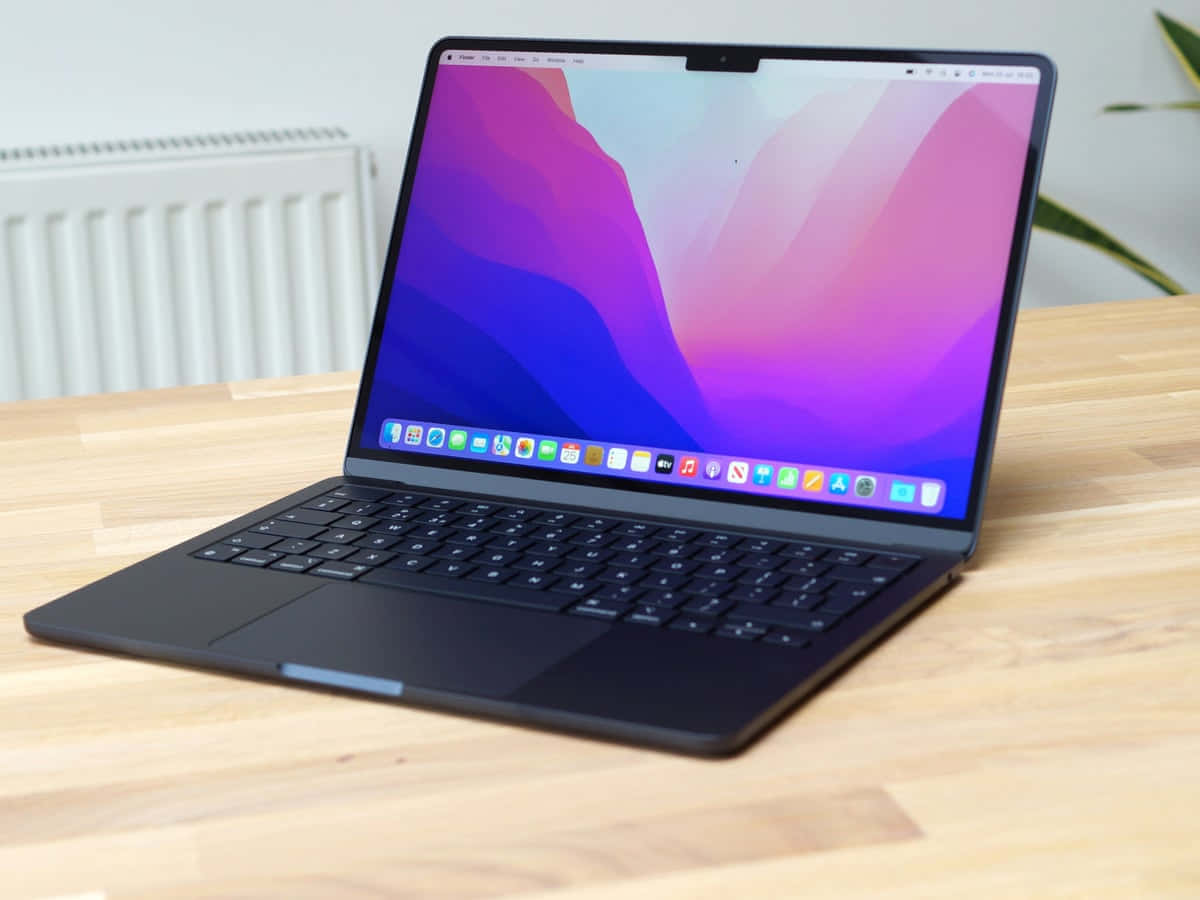 Black MacBook - Designed to Do It All Wallpaper