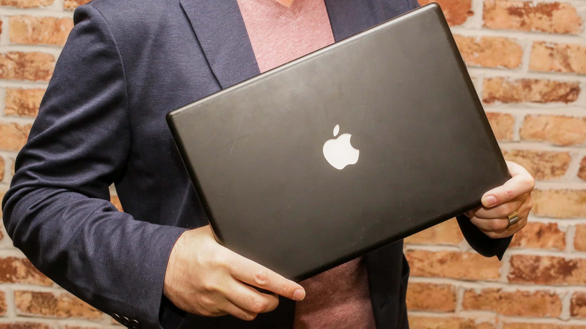 A sleek black MacBook for the modern user Wallpaper