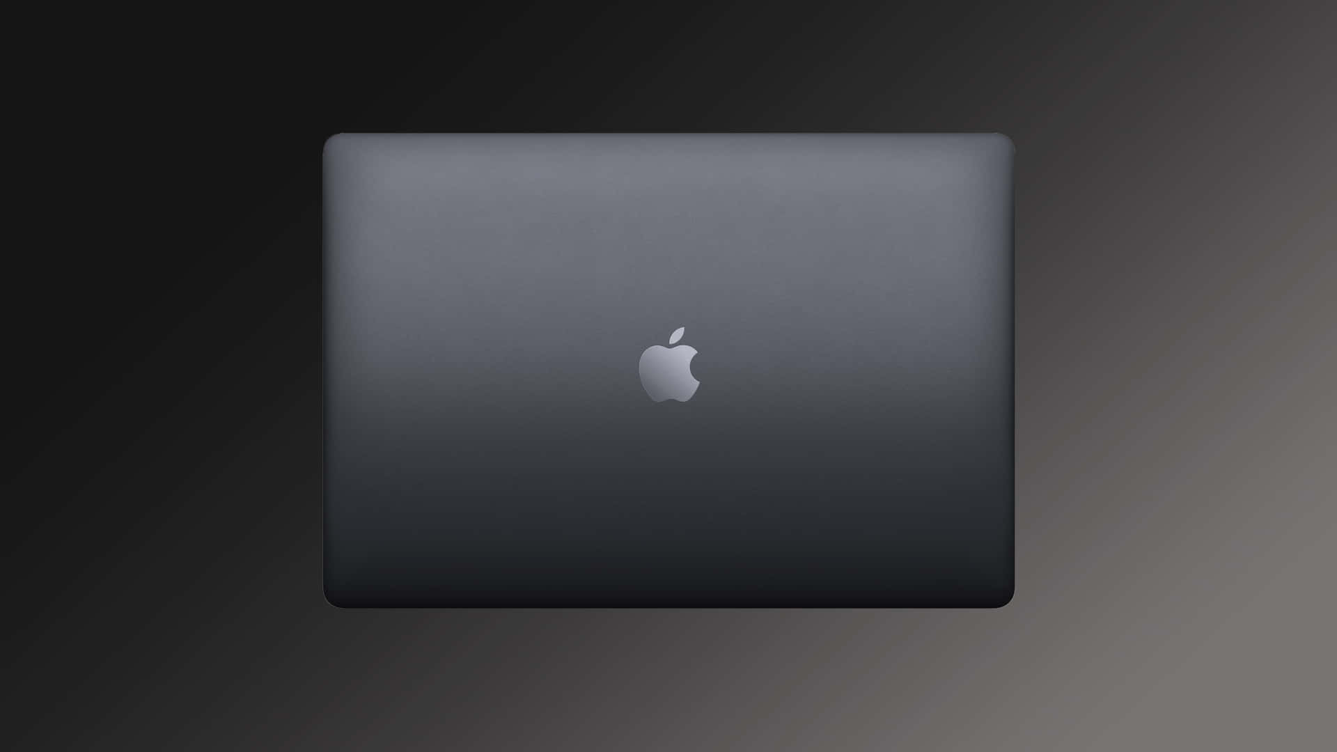 A Black Macbook Pro With A Logo On It Wallpaper