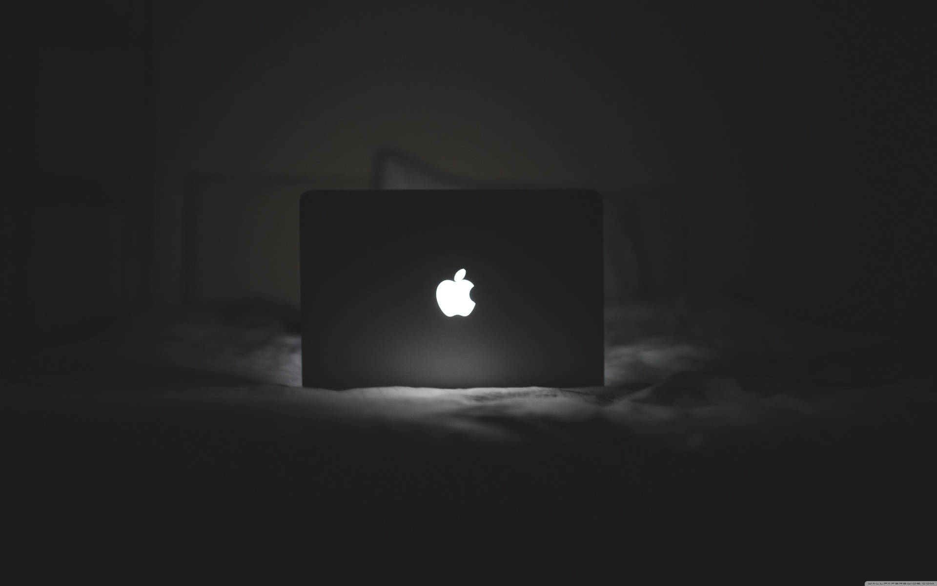 Black Macbook Laptop - Ready for productivity and creativity Wallpaper
