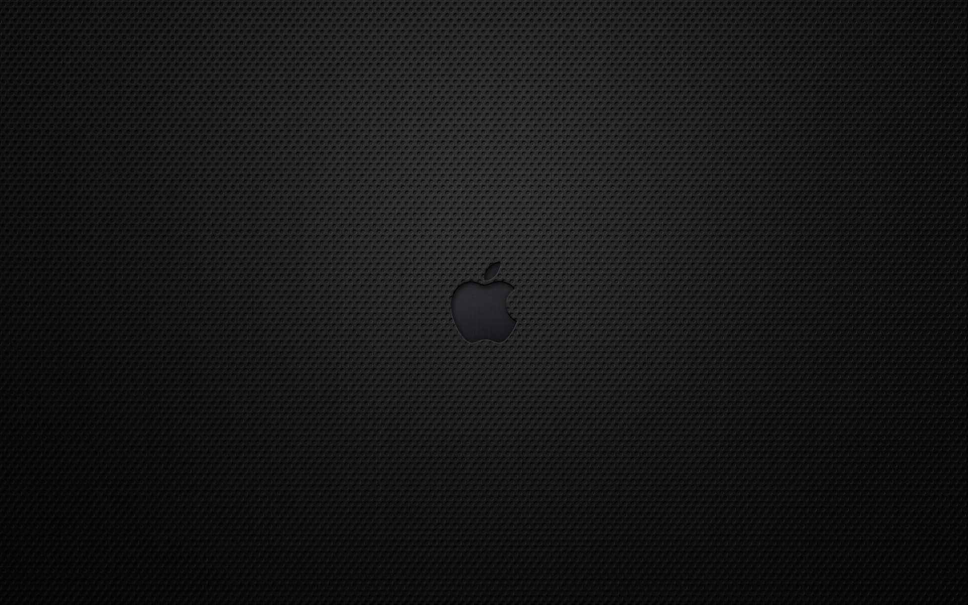 Obténla Belleza Atemporal Del Color Negro Con El Icónico Macbook De Apple. Fondo de pantalla