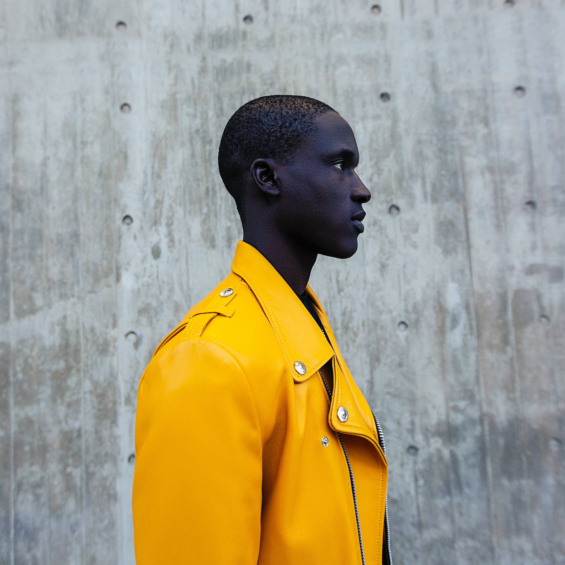 Black Man In Yellow Leather Jacket Background