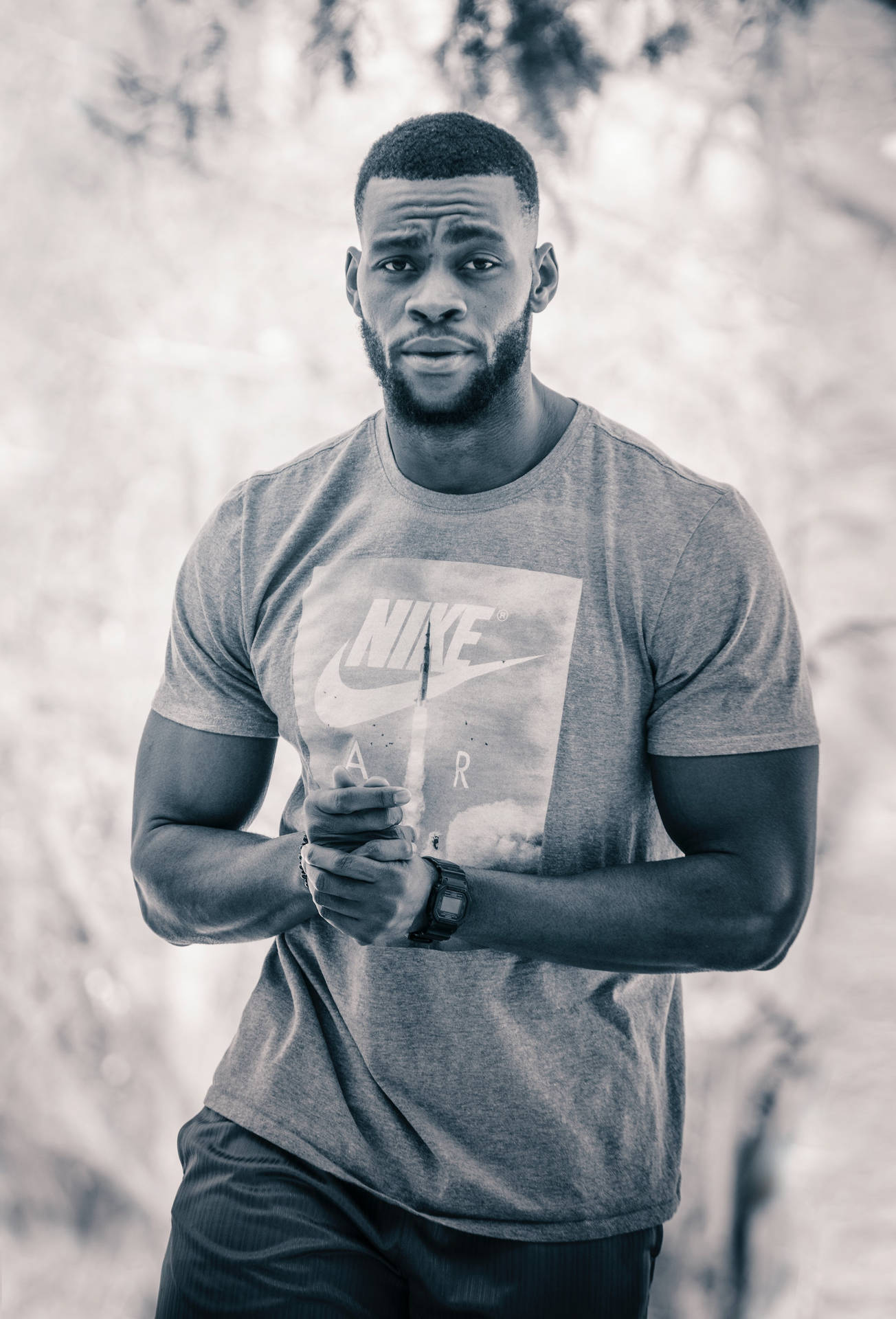 Black Man Modeling A Nike Air Shirt Background