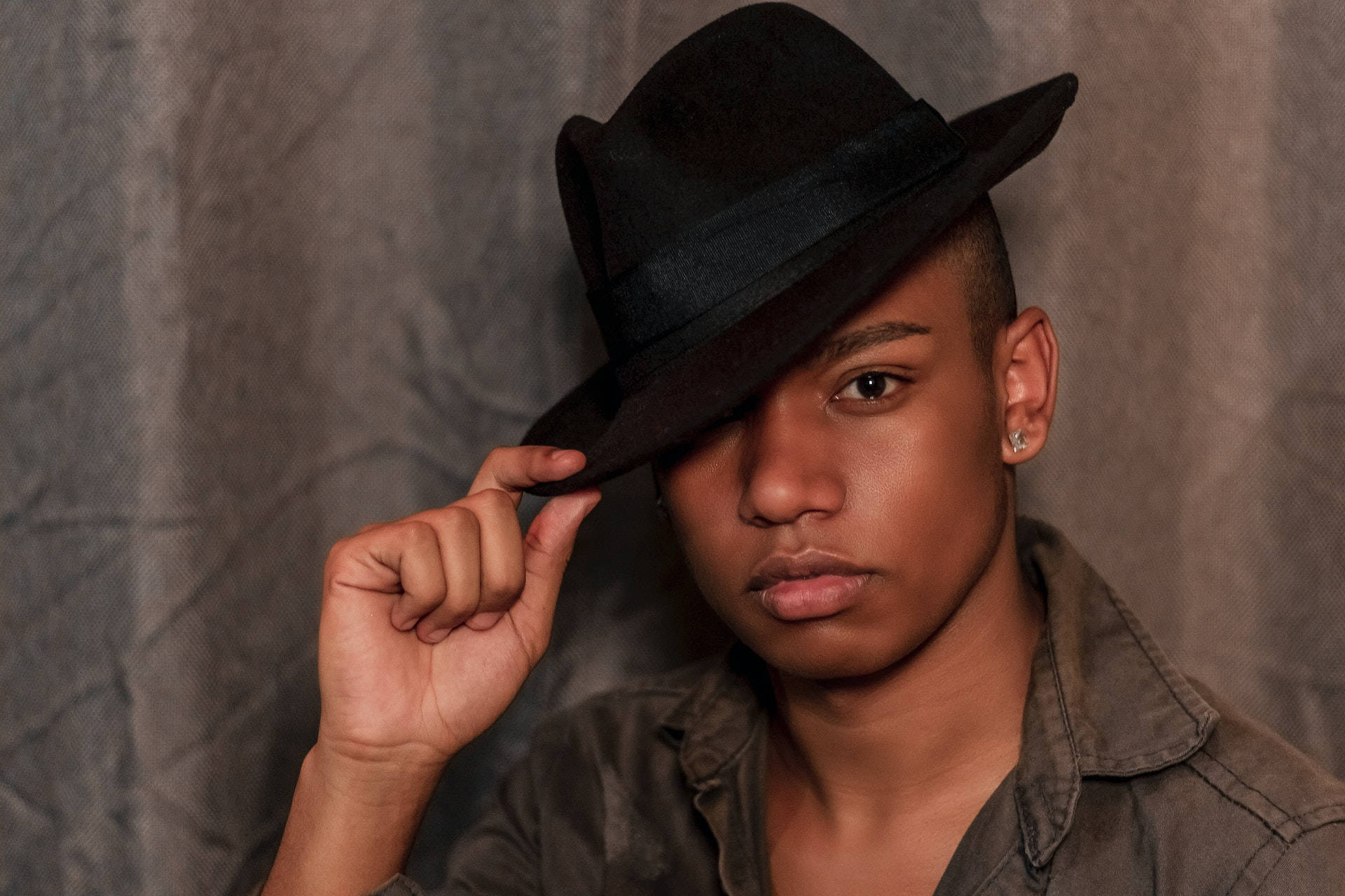 Black Man With A Fedora Hat On Background