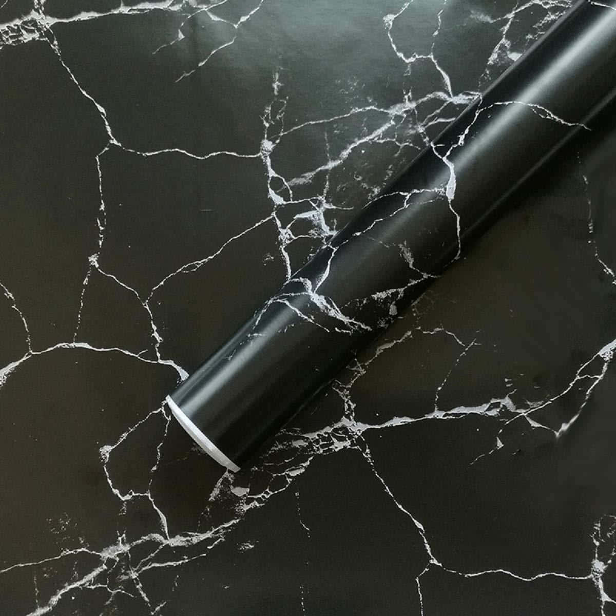 En sort marmoroverflade med en rulle tape