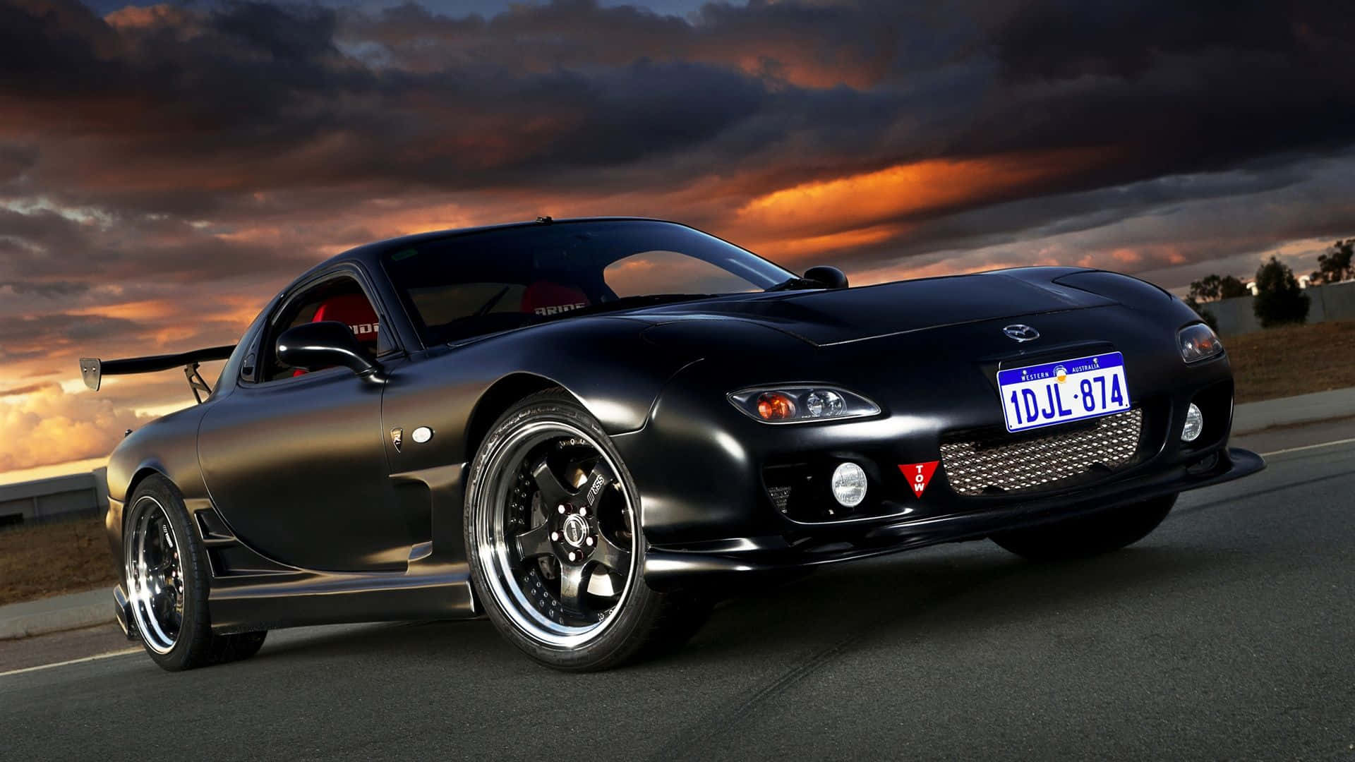 Download Black Mazda Rx 7 With Stormy Sky Wallpaper 