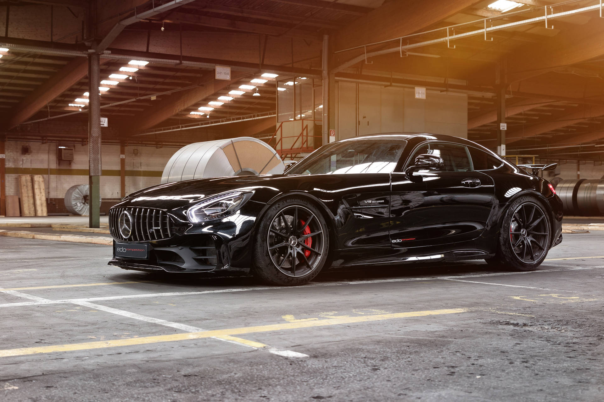 Caption: Majestic Black Mercedes AMG GT R Showcasing Power and Elegance Wallpaper