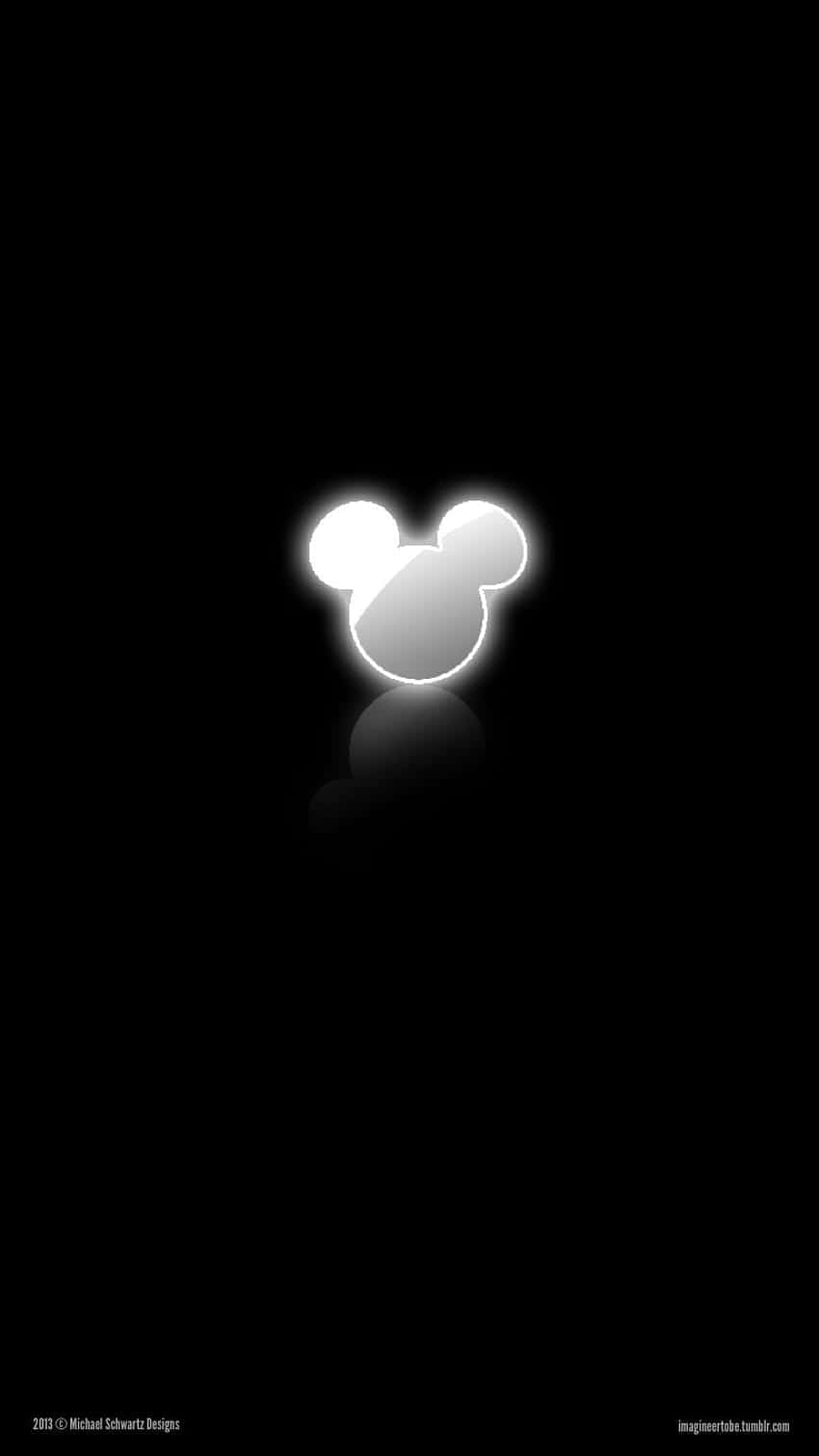 A Mickey Mouse Logo On A Black Background Wallpaper