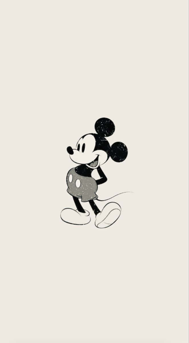 Disney's ikoniske Mickey Mouse står ud på et stilsikkert sort baggrund. Wallpaper