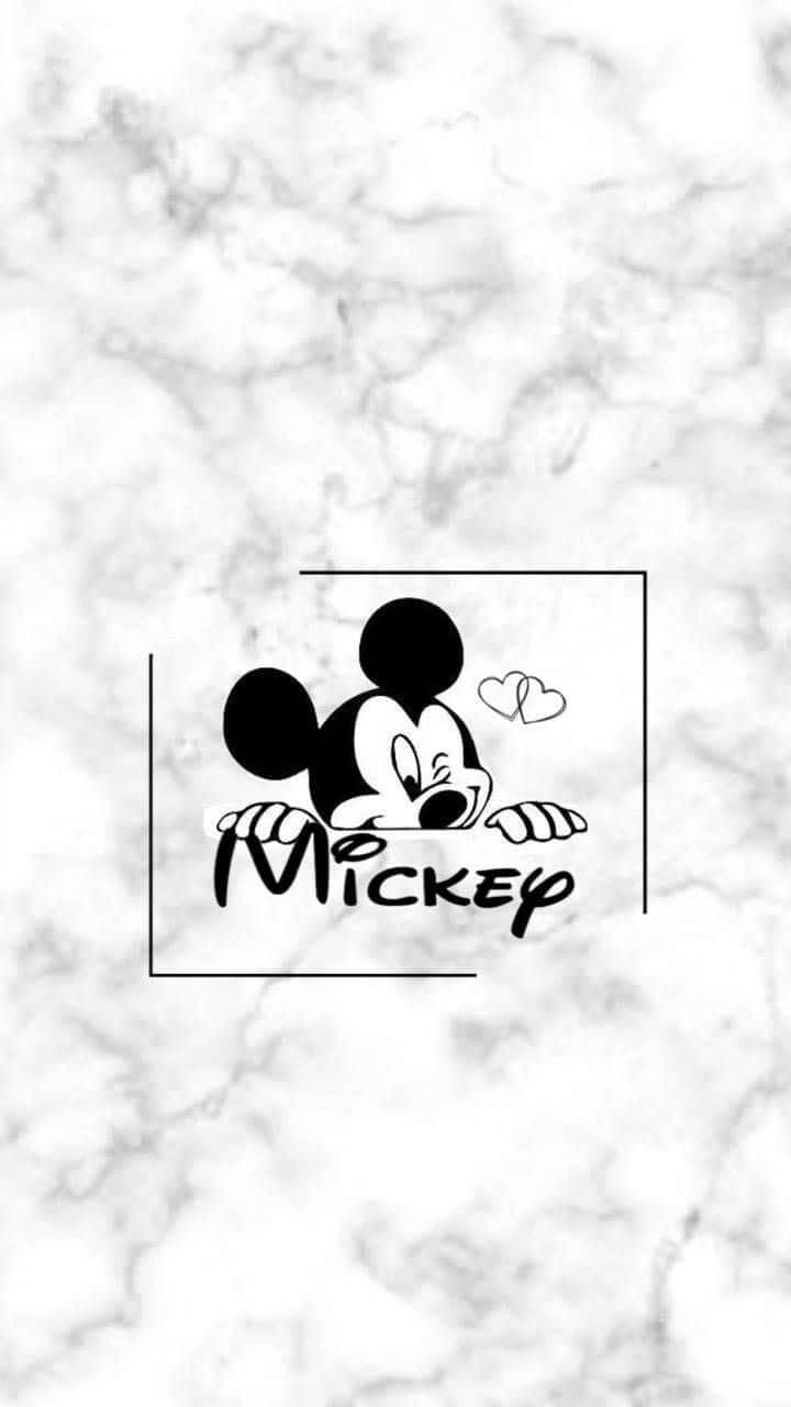 Mickey Mouse Logo On A Marble Background Wallpaper