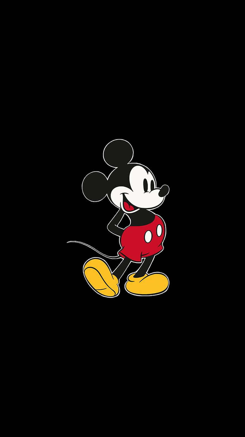 Mickey Mouse Logo On A Black Background Wallpaper