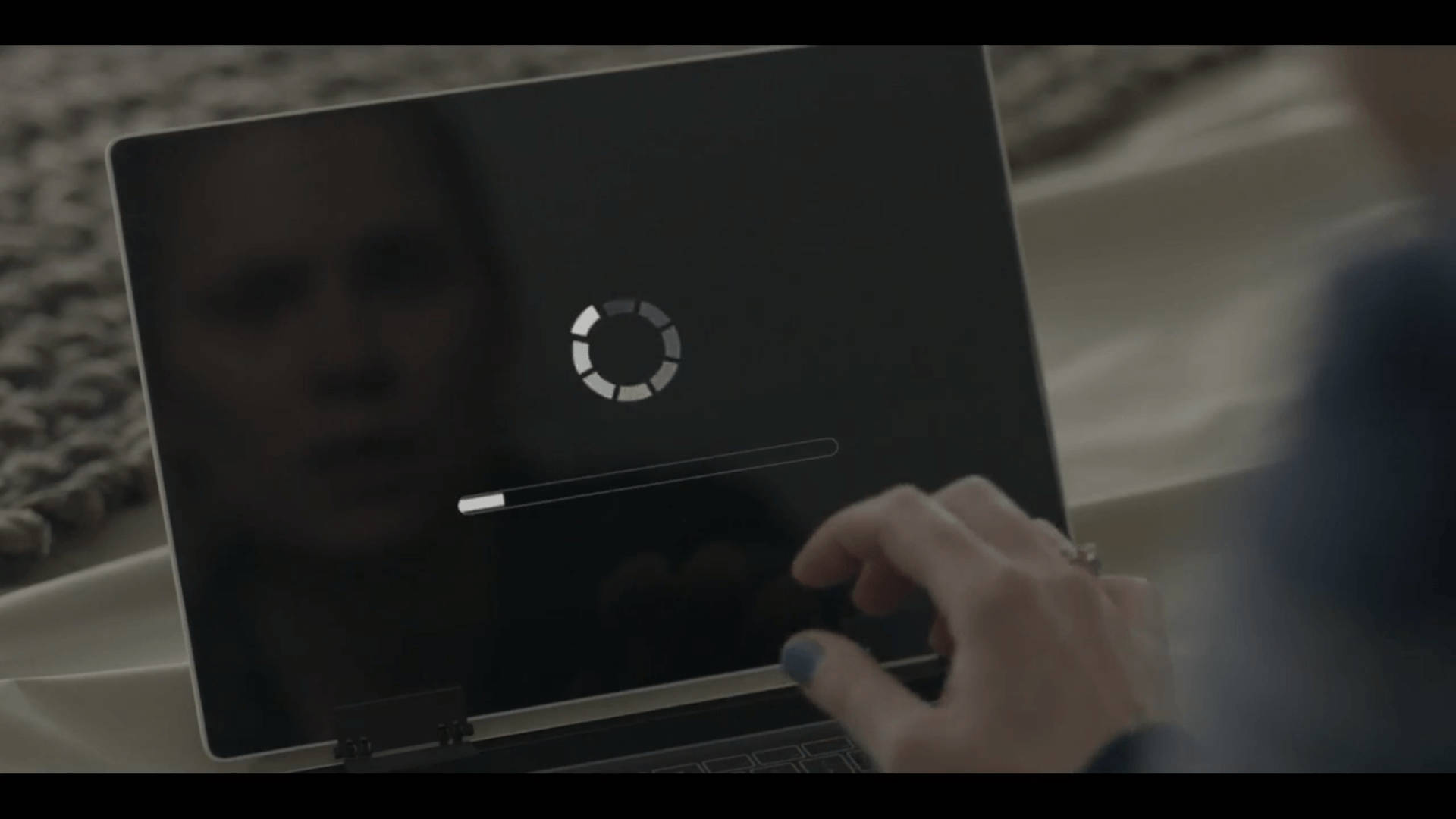Black Mirror Laptop Displaying Loading Icon Wallpaper