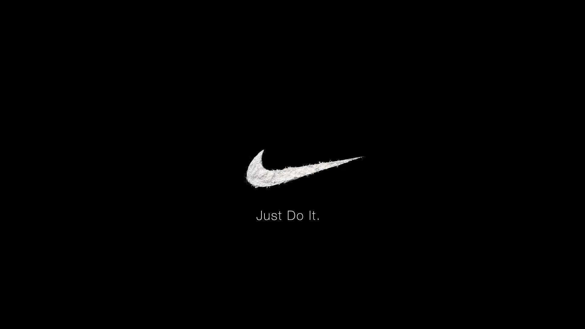 Download Nike Logo On A Black Background Wallpaper | Wallpapers.com