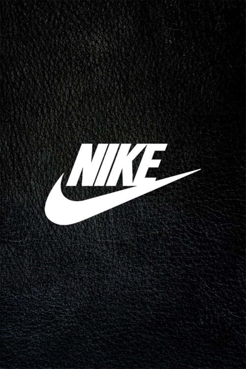 Nike Logo On A Black Leather Background Wallpaper