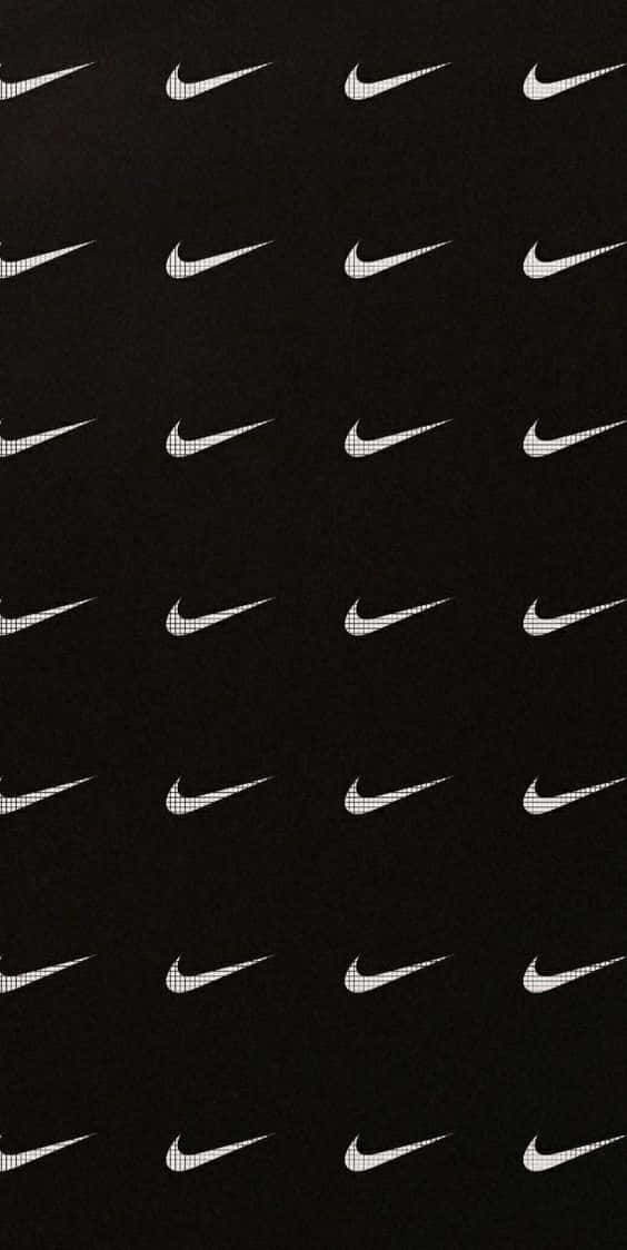 Caption: Iconic Black Nike Sneakers Wallpaper