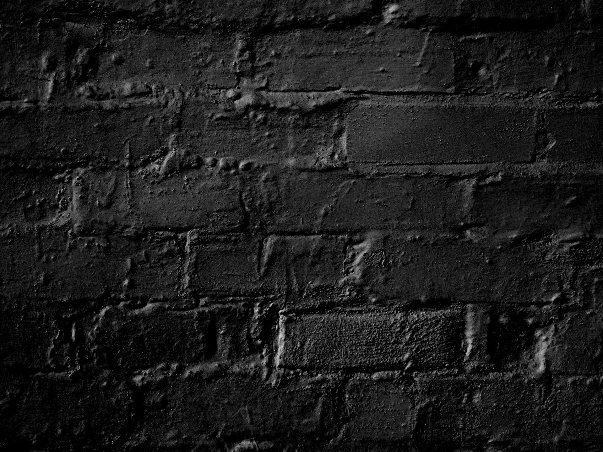 Et sort og hvidt foto af en mursten væg Wallpaper