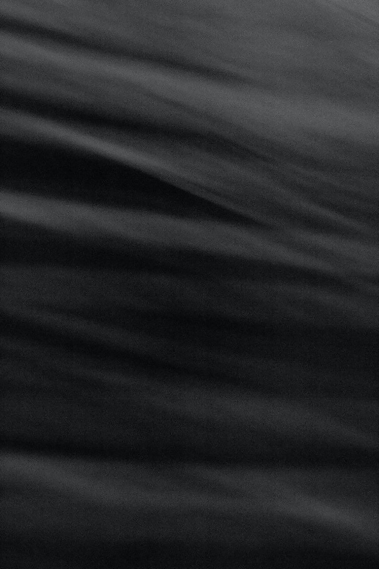 A Black And White Photo Of A Wave Wallpaper