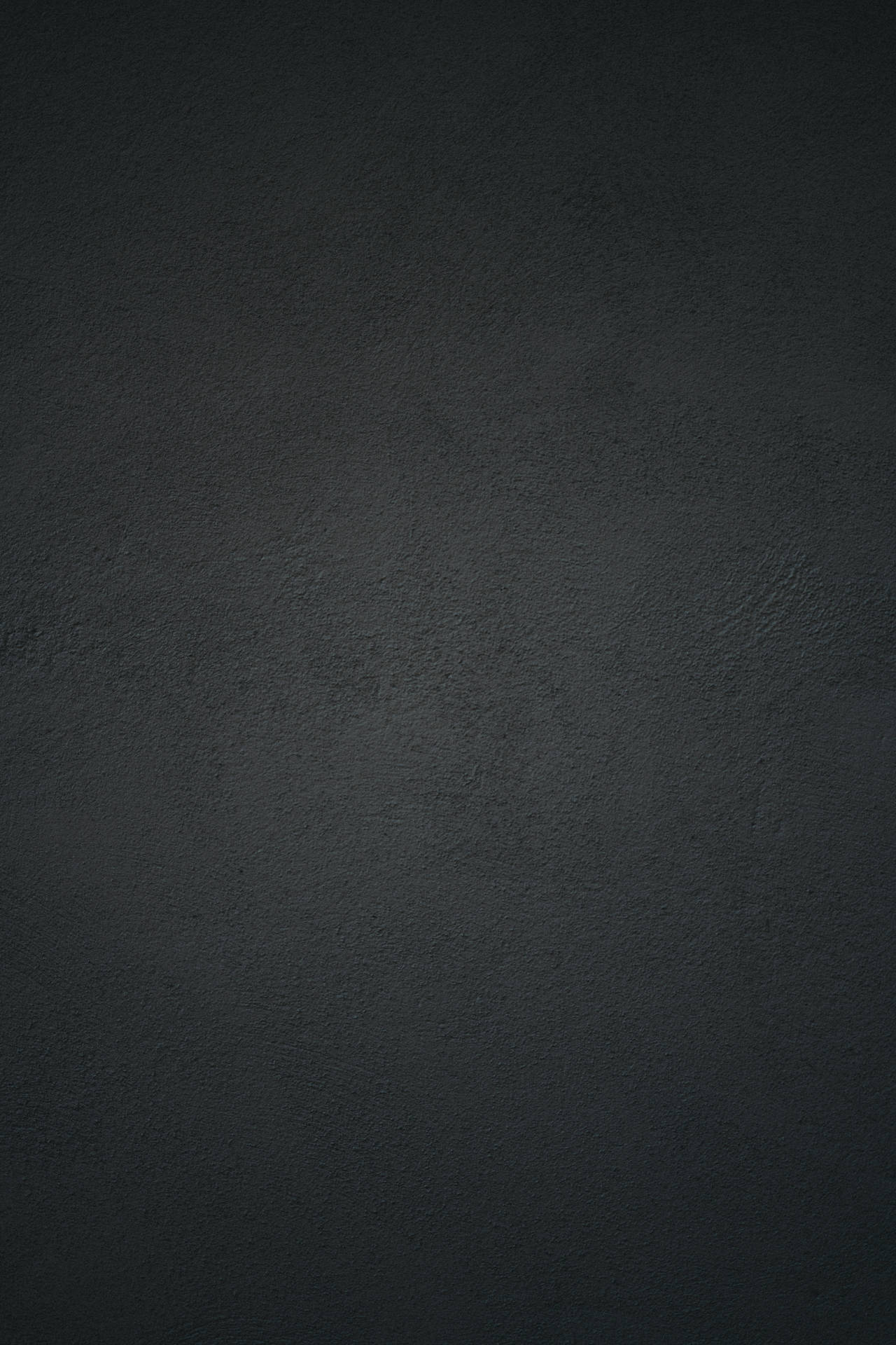 Sort betonvæg baggrund med et lysreflektion Wallpaper