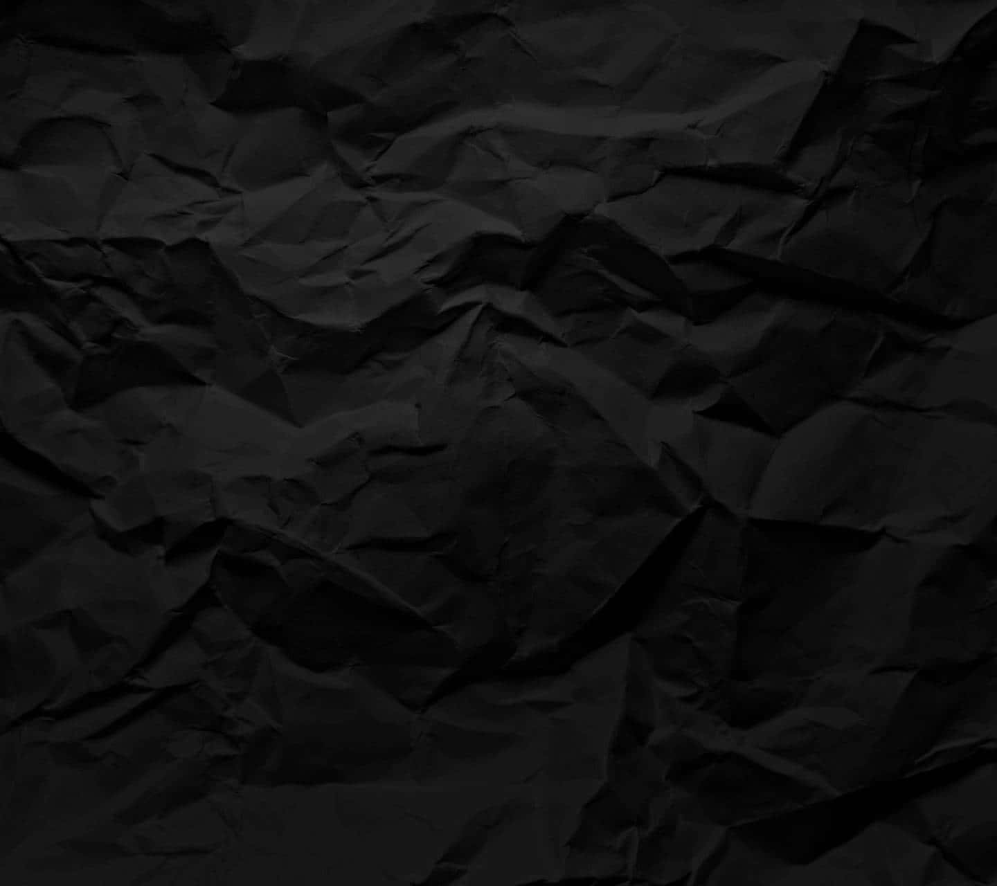 Black Crumpled Paper Background