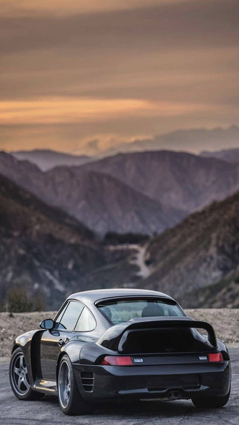 Black Porsche 911 Overlooking The Mountains Wallpaper
