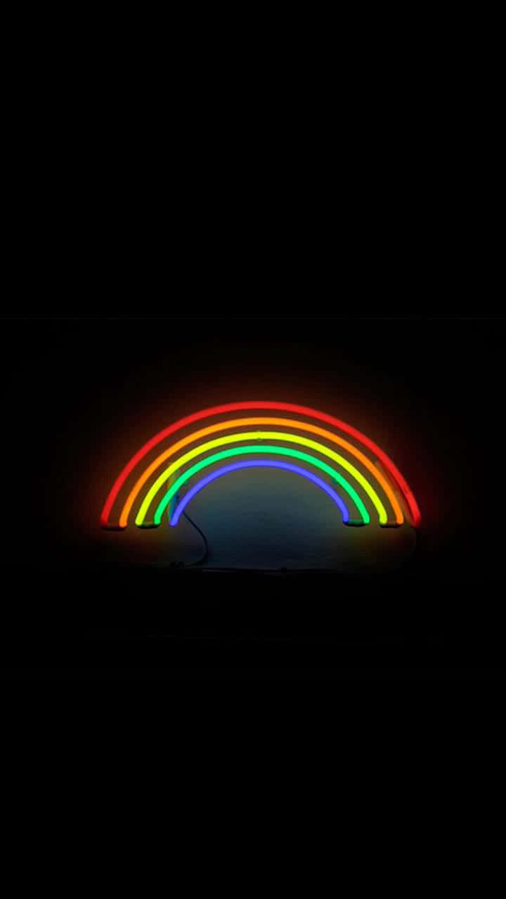 A beautiful black rainbow stretches across the sky Wallpaper