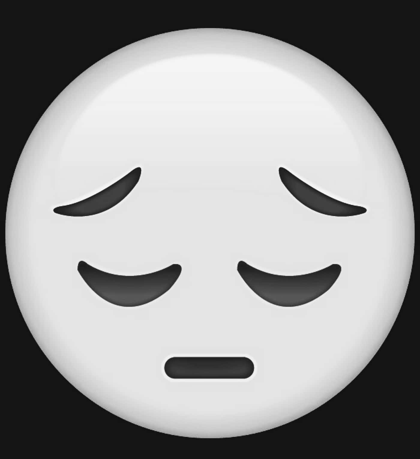A White Emoticion With Eyes Closed