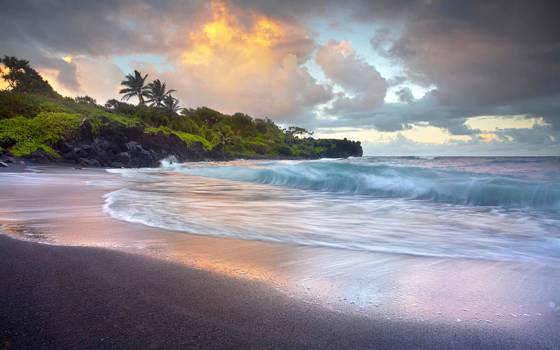 A Relaxing Scene of the Majestic Black Sand Beach Wallpaper