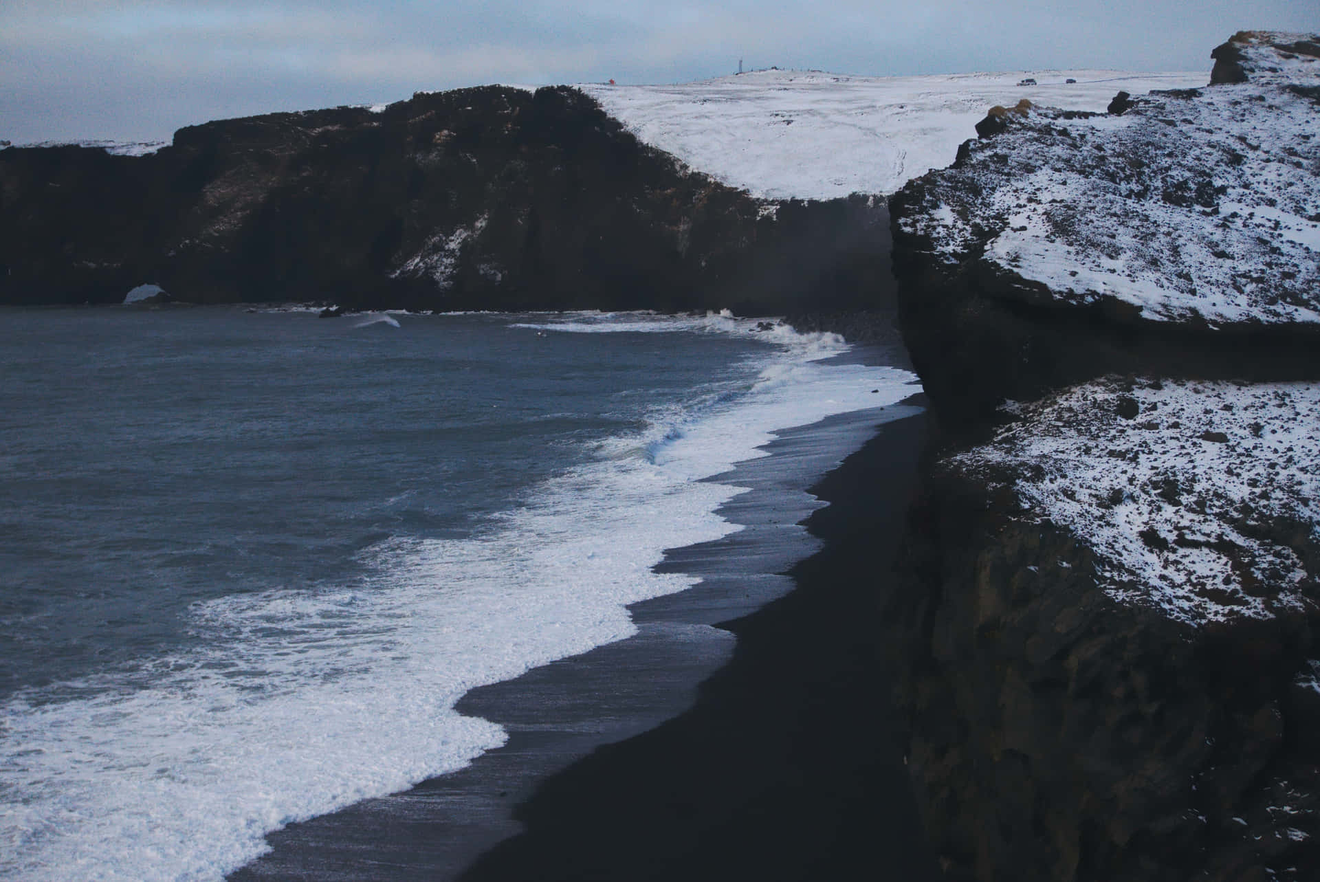 Relax and let the sea breeze wash away worry at this stunning Black Sand Beach. Wallpaper
