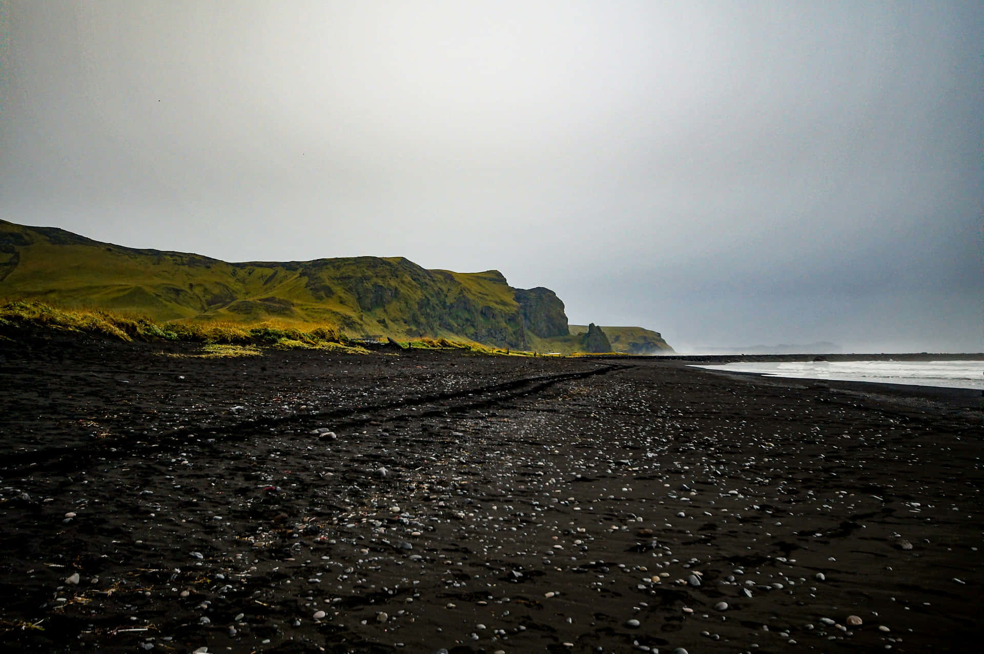 The Outstanding Beauty of the Black Sand Beach Wallpaper