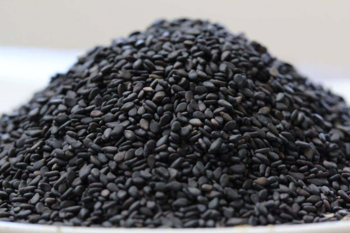 Amazing bowl of nutritious black sesame seeds Wallpaper