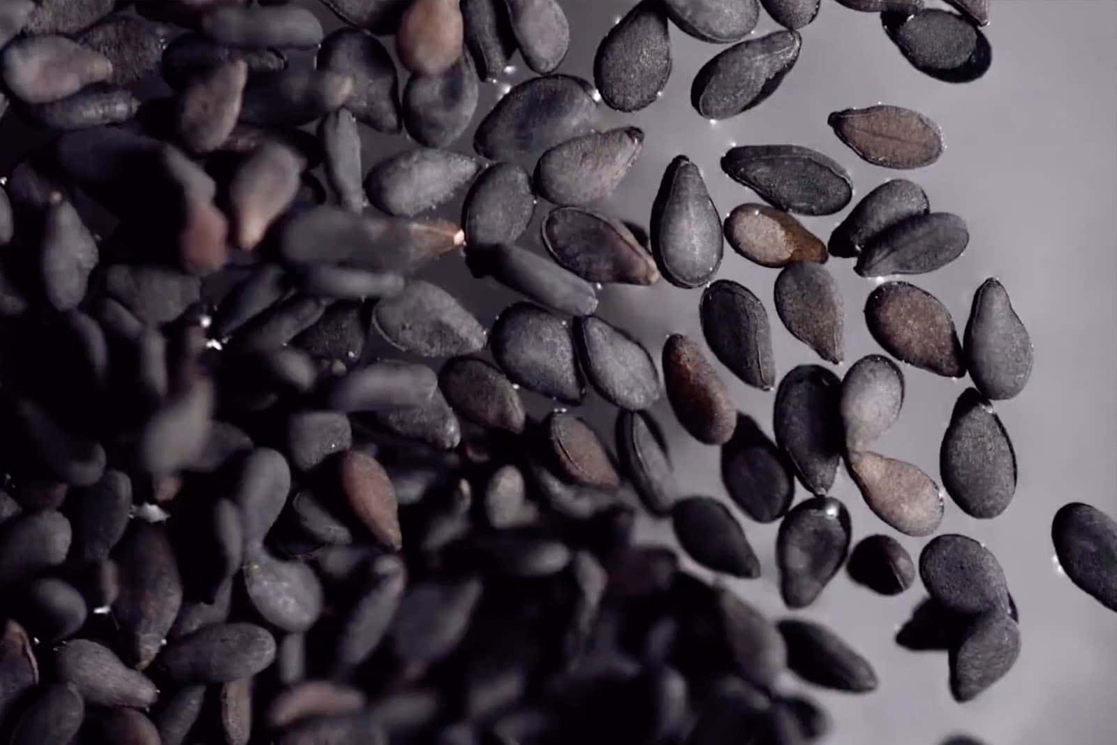 Freshly ground black sesame seeds, ready to be enjoyed. Wallpaper