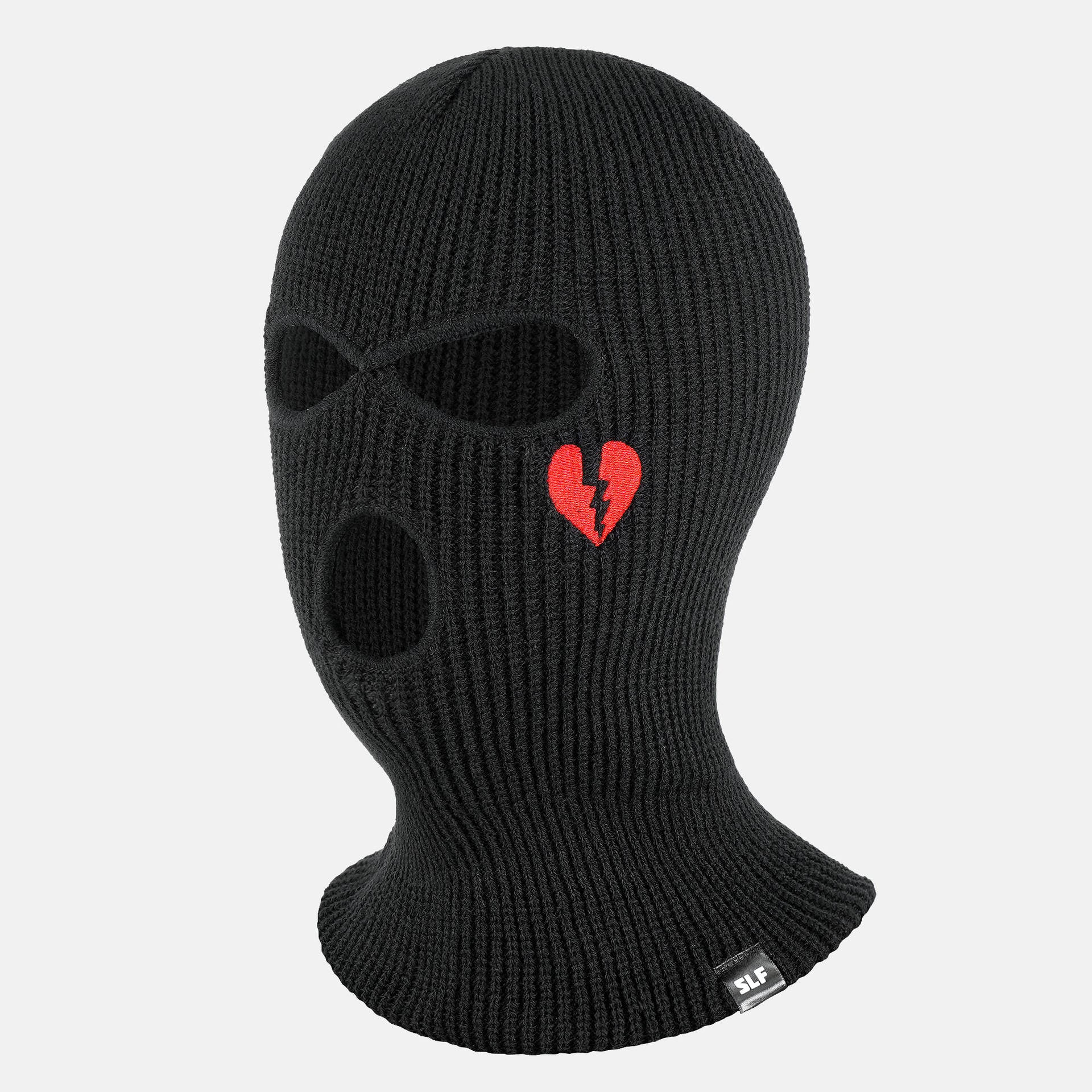 A Black Knitted Mask With A Heart On It Wallpaper