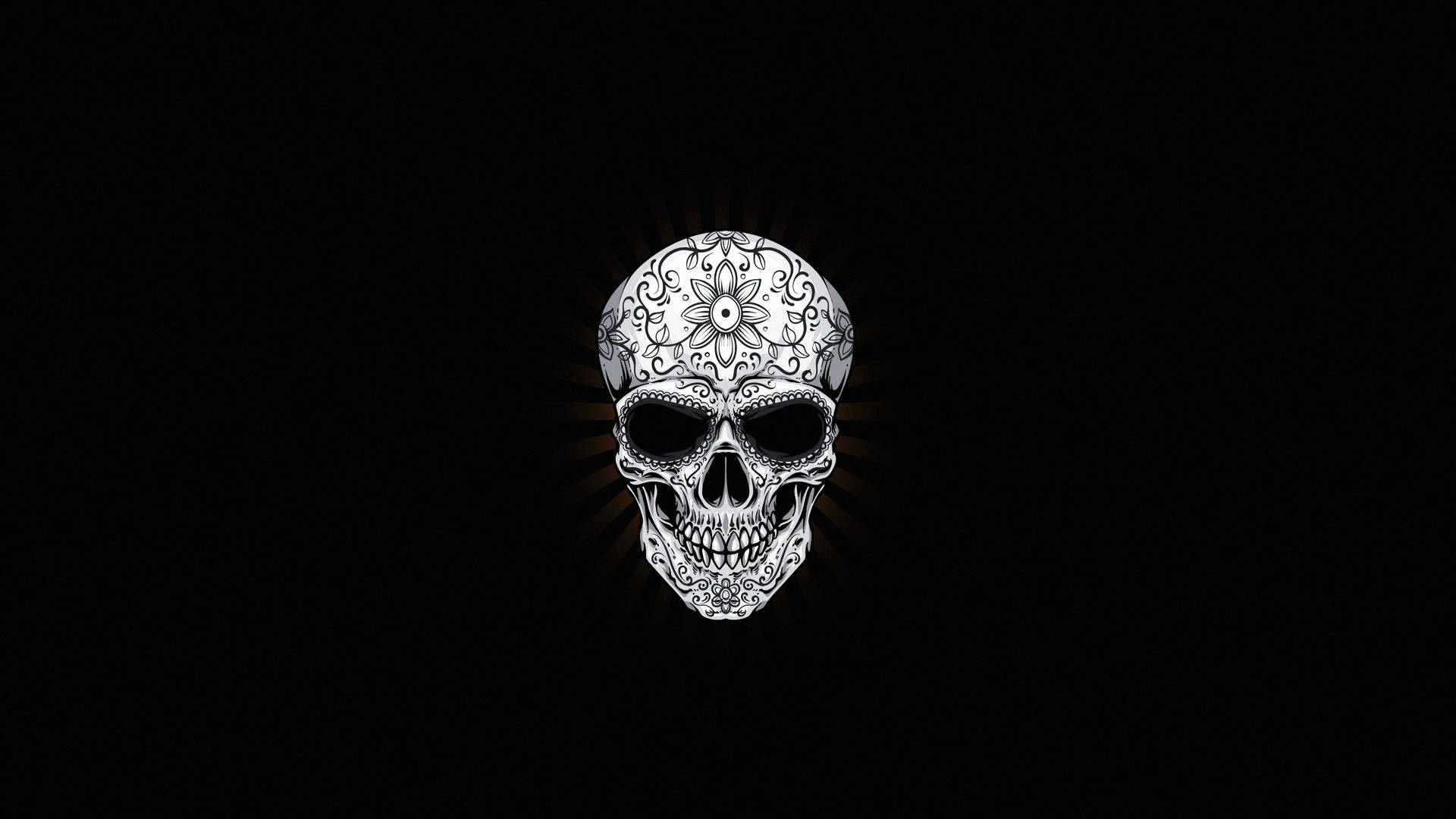 A sinister black skull looking out from its ominous dark background. Wallpaper