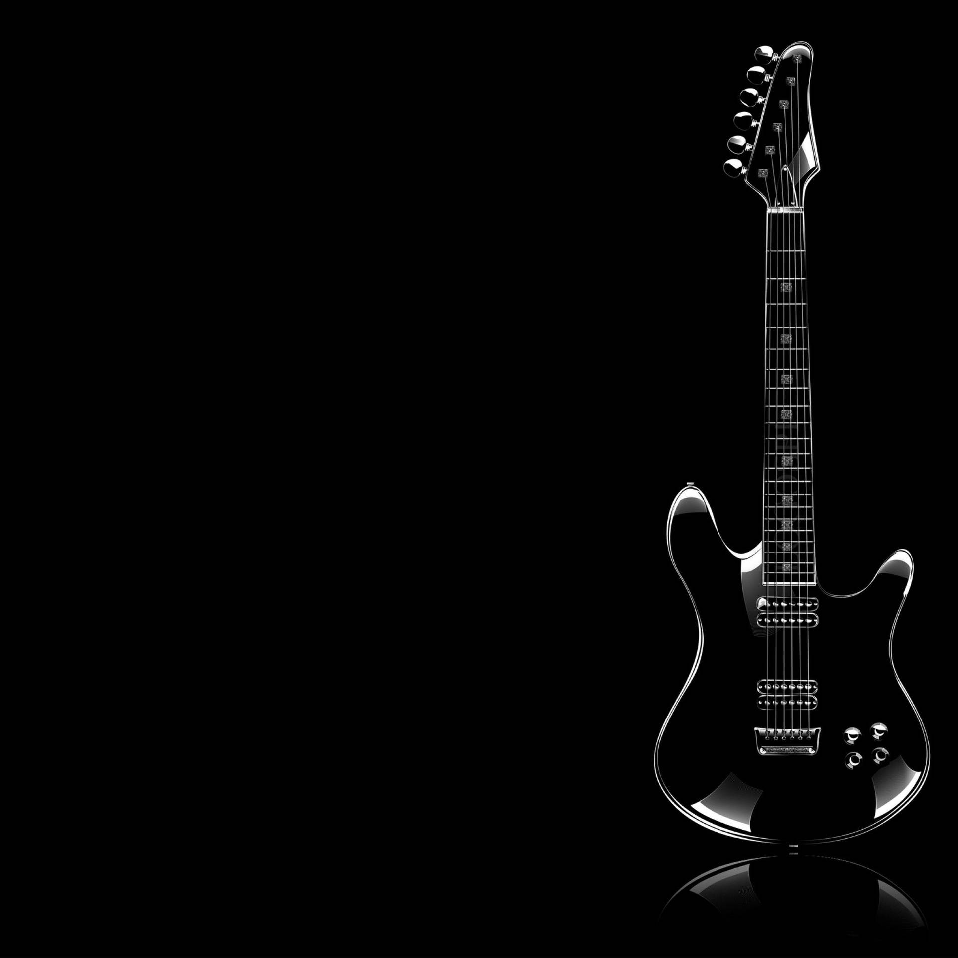 Awesome wallpaper of black, shiny guitar on black background. 