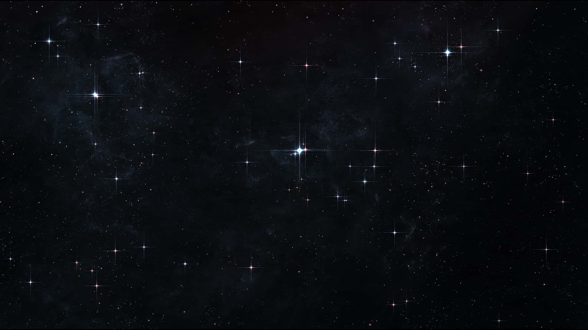 En sort baggrund med stjerner og stjerner glimtende Wallpaper