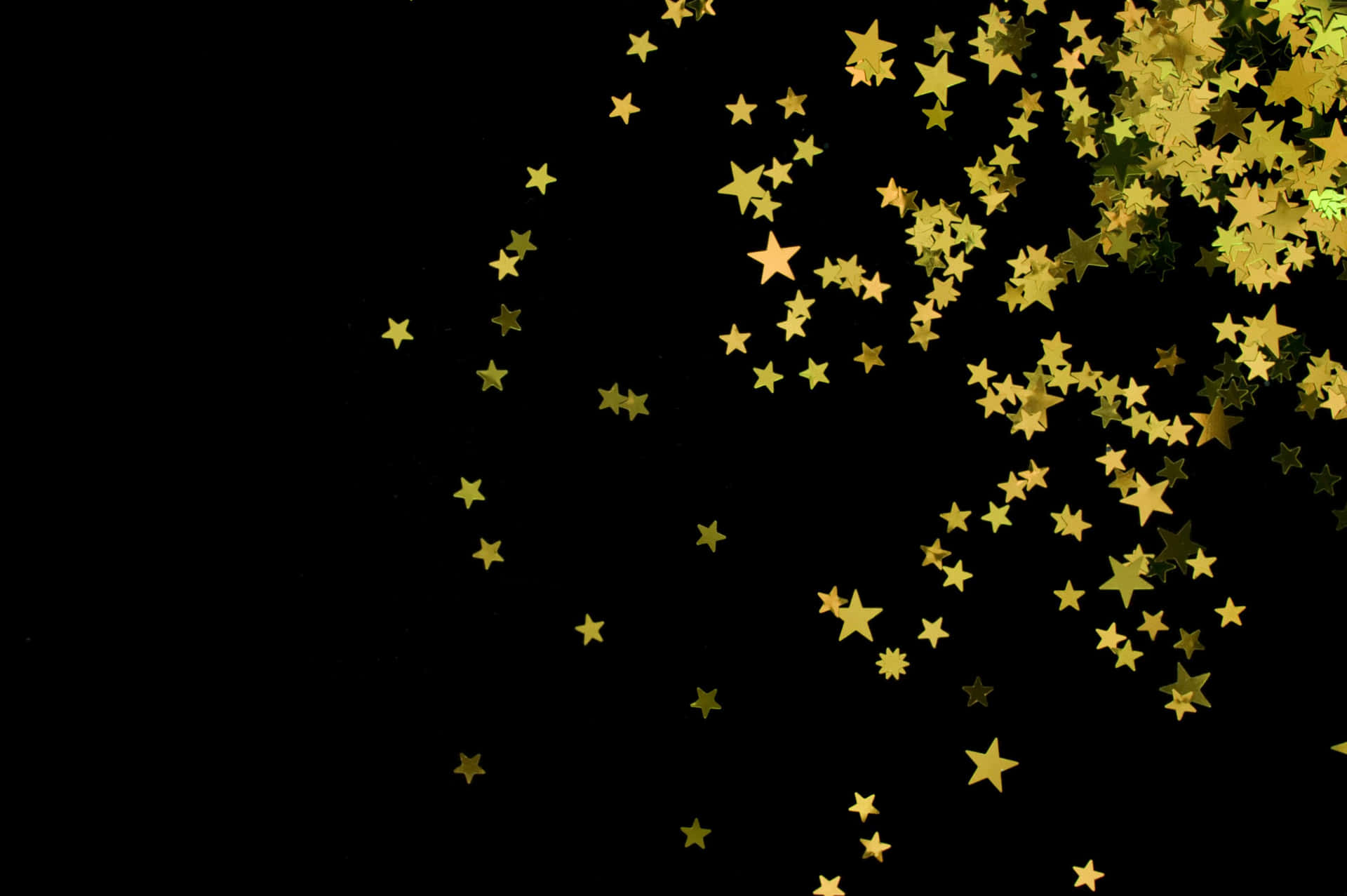 Guldstjerner sort glimmer baggrund