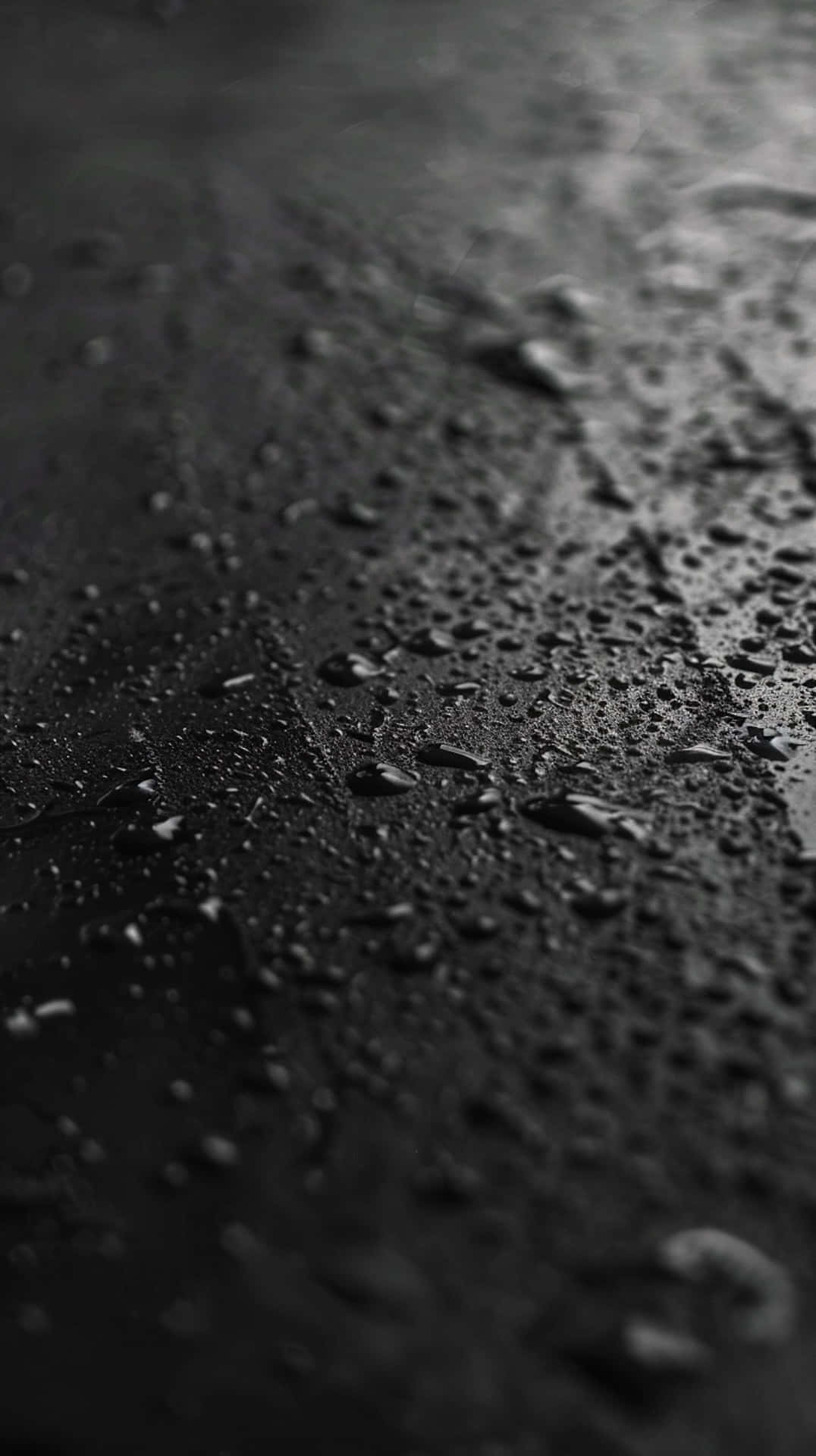 Black_ Surface_with_ Water_ Droplets Wallpaper