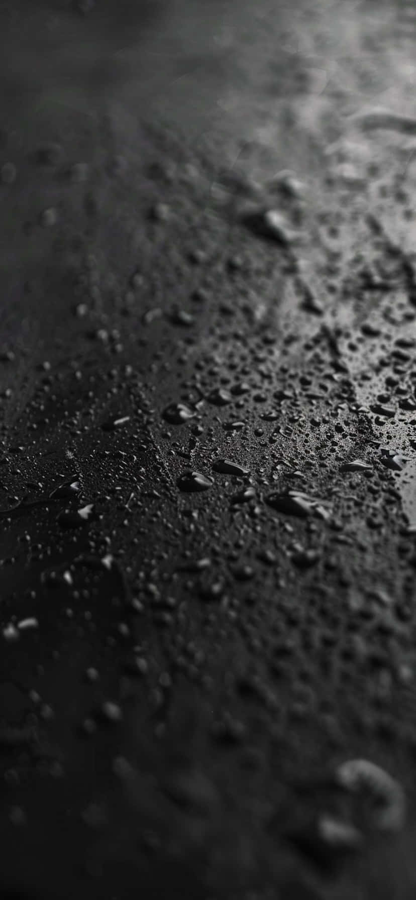 Black Wet Surfacewith Raindrops Wallpaper