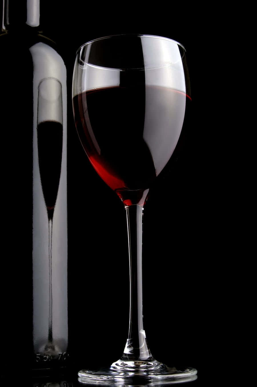 “A tantalising glass of black wine” Wallpaper