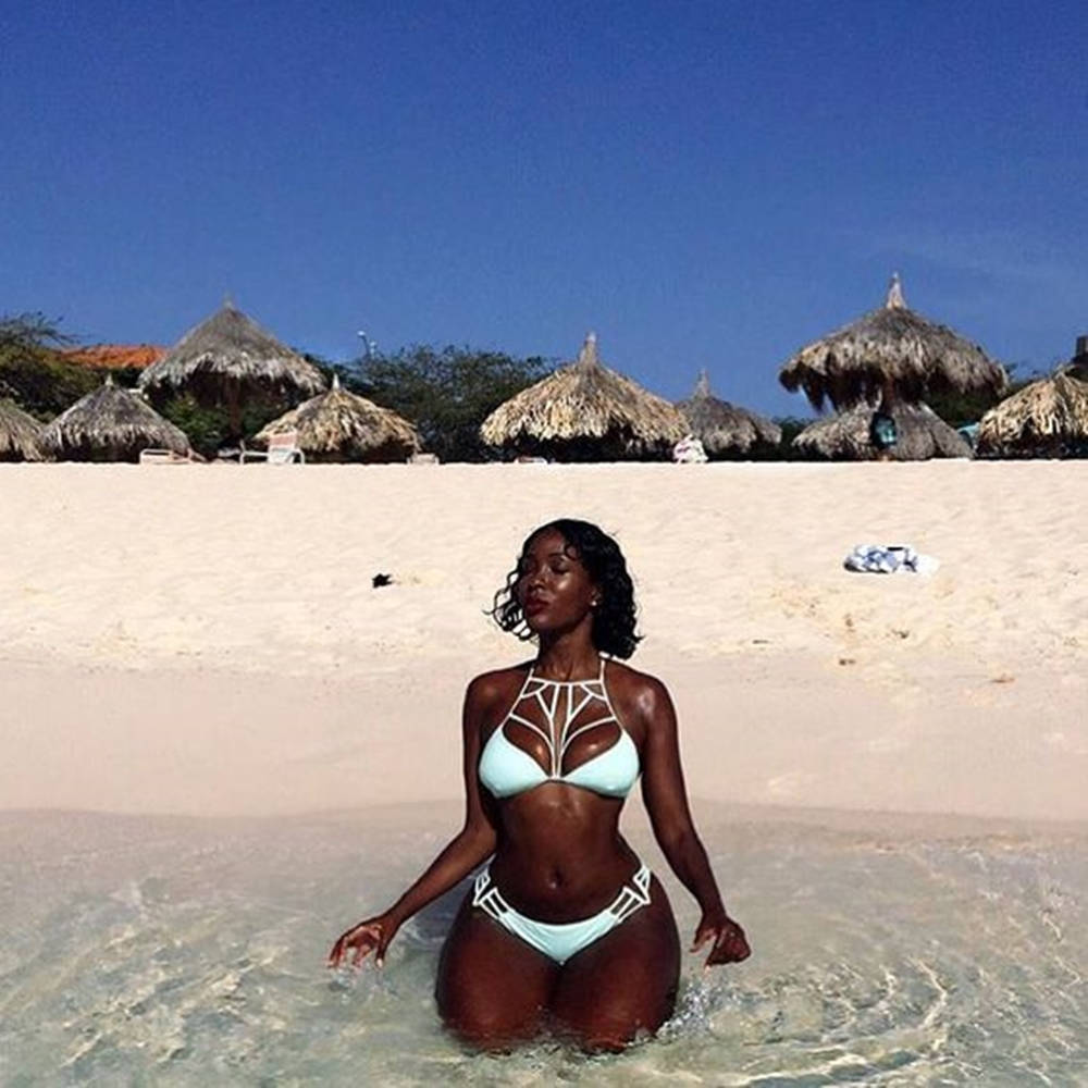 Black Woman In Bikini Huts Beach Wallpaper