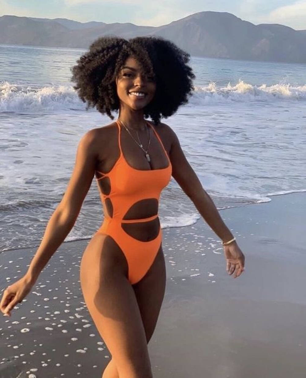 Black Woman In Bikini Waves Wallpaper