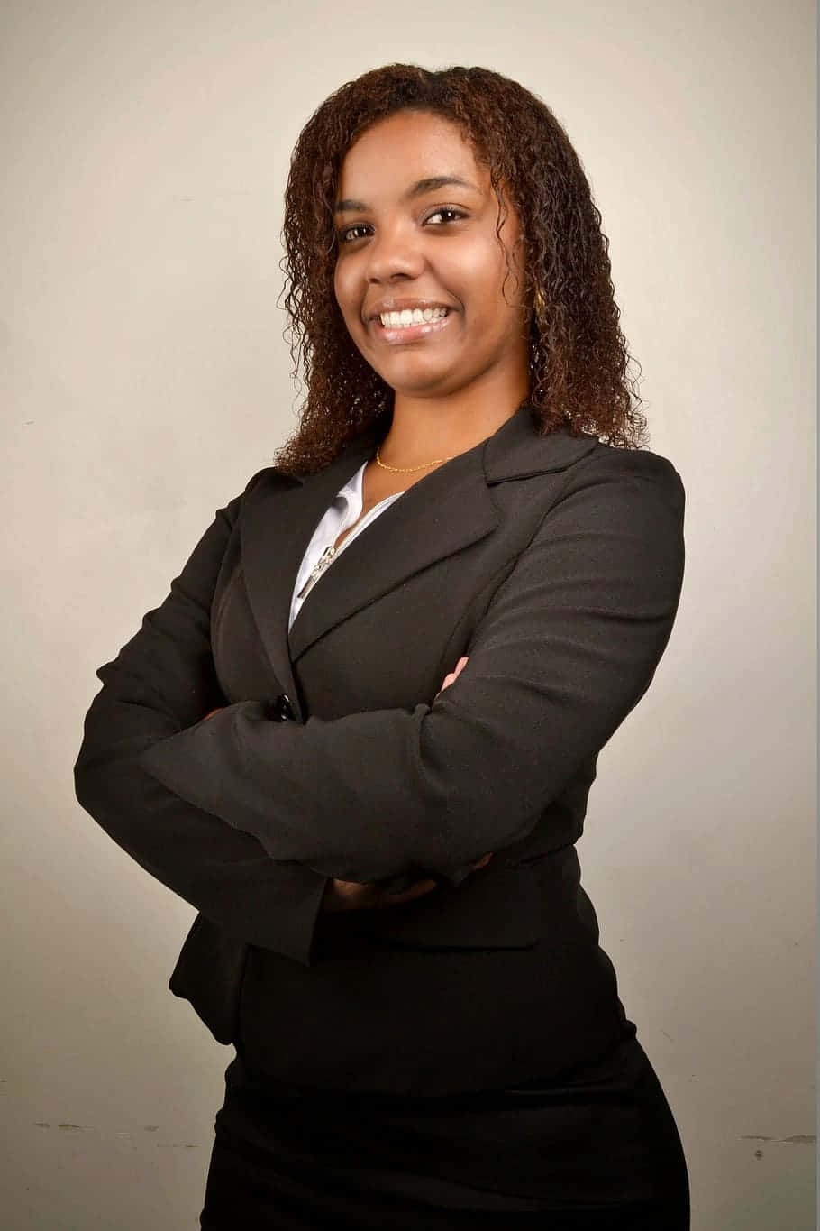 Young Professional Black Woman Dressed in Business Attire Wallpaper