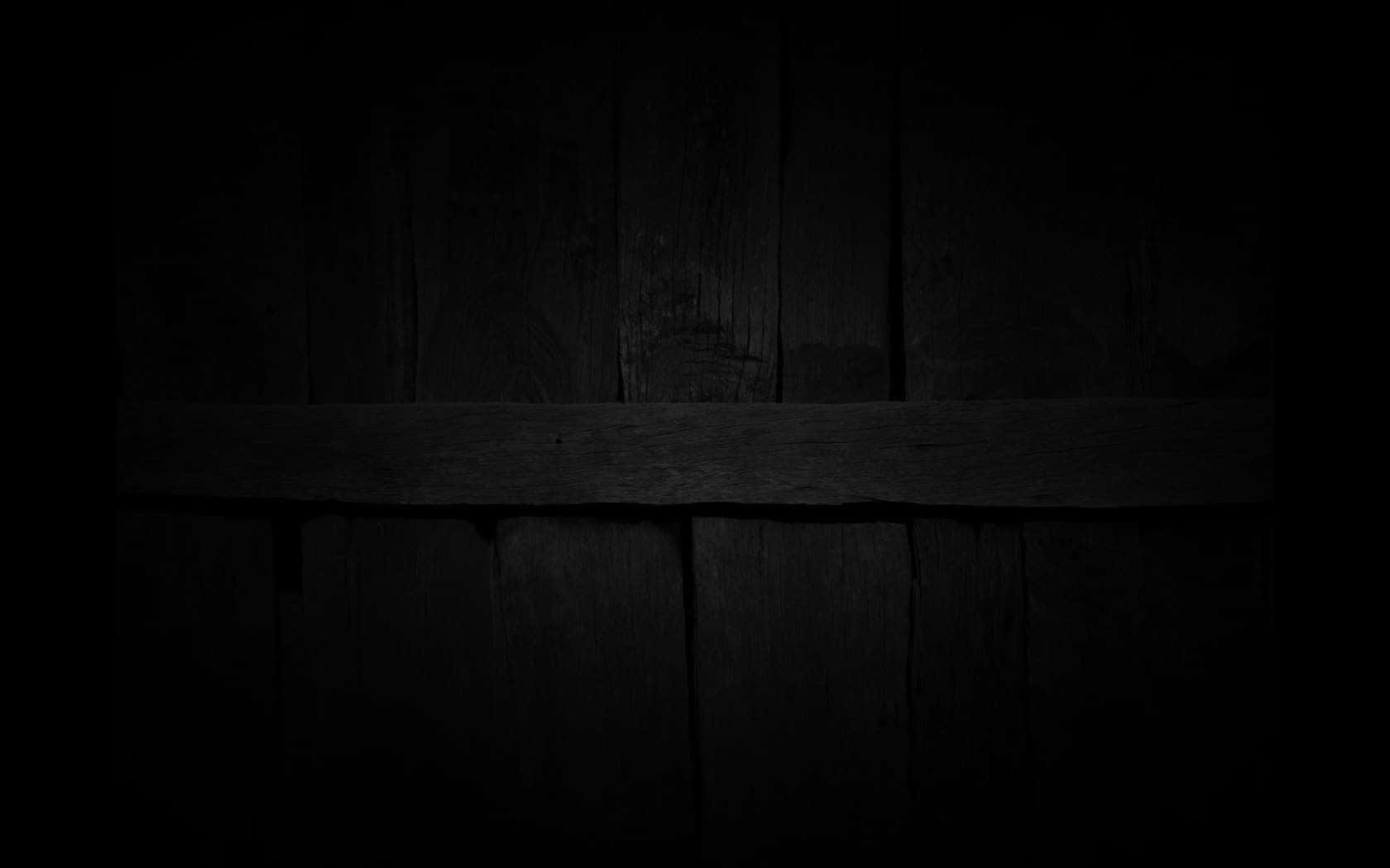 A Dark Wooden Background With A Wooden Plank