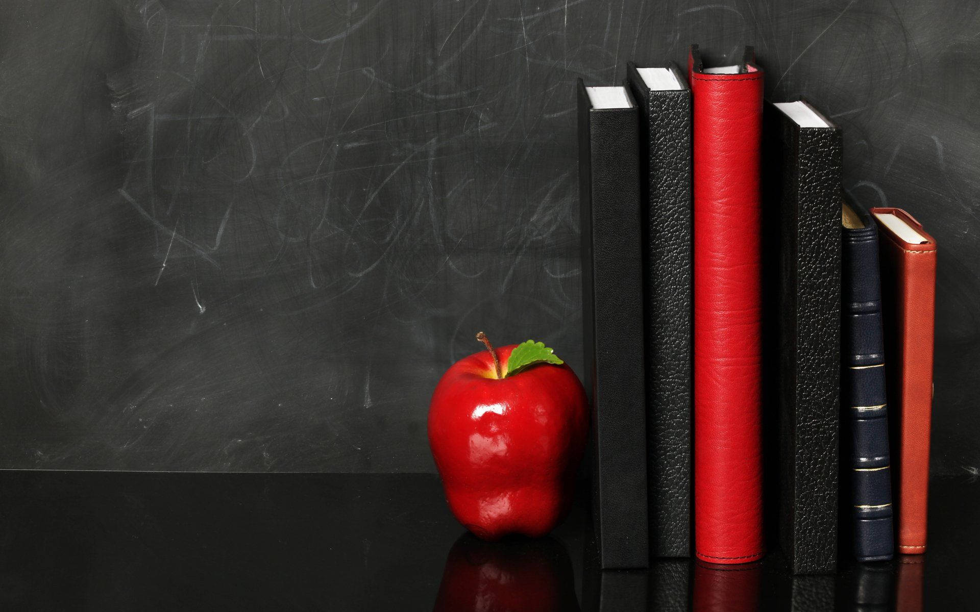 Blackboard apple and six standing books wallpaper