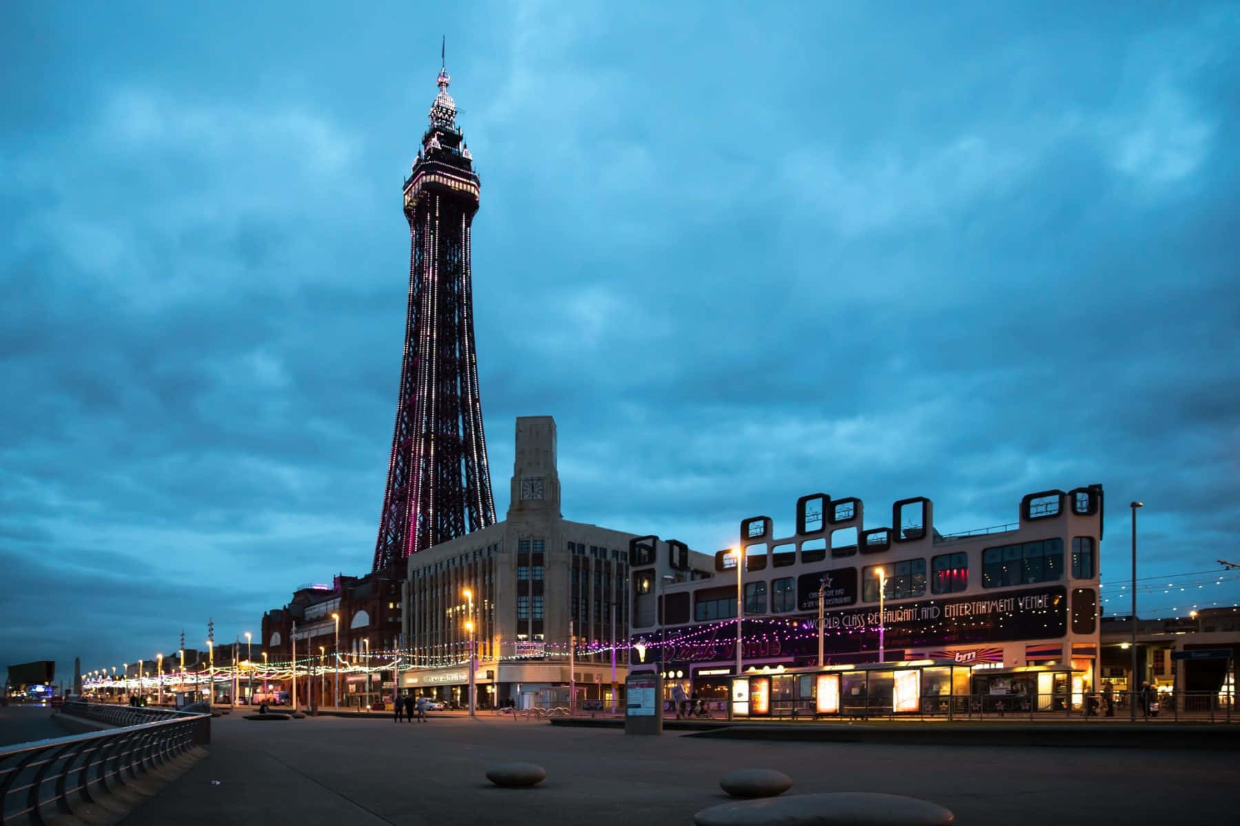Majestic Blackpool Tower against a Cloudy Blue Sky Wallpaper