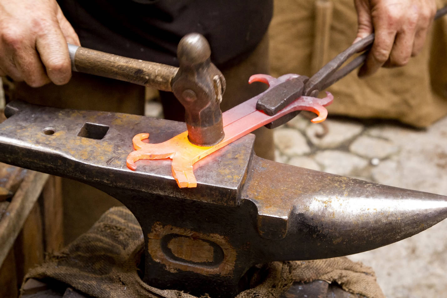 Blacksmith Forging Iron Metal With Tools Wallpaper