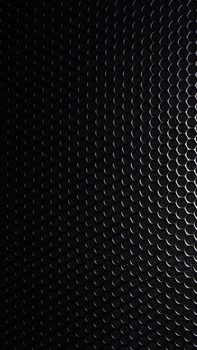 Blank Black Steel Plate With Holes Wallpaper
