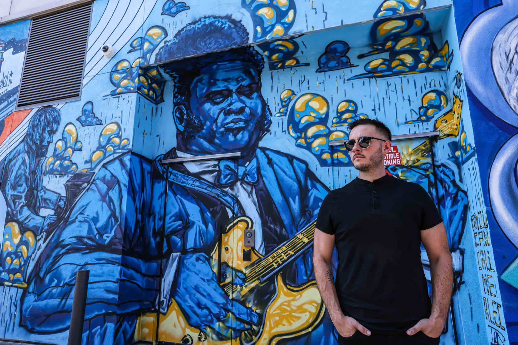 Caption: Vibrant Mural Celebrating Blues Legend Blind Lemon Jefferson Wallpaper